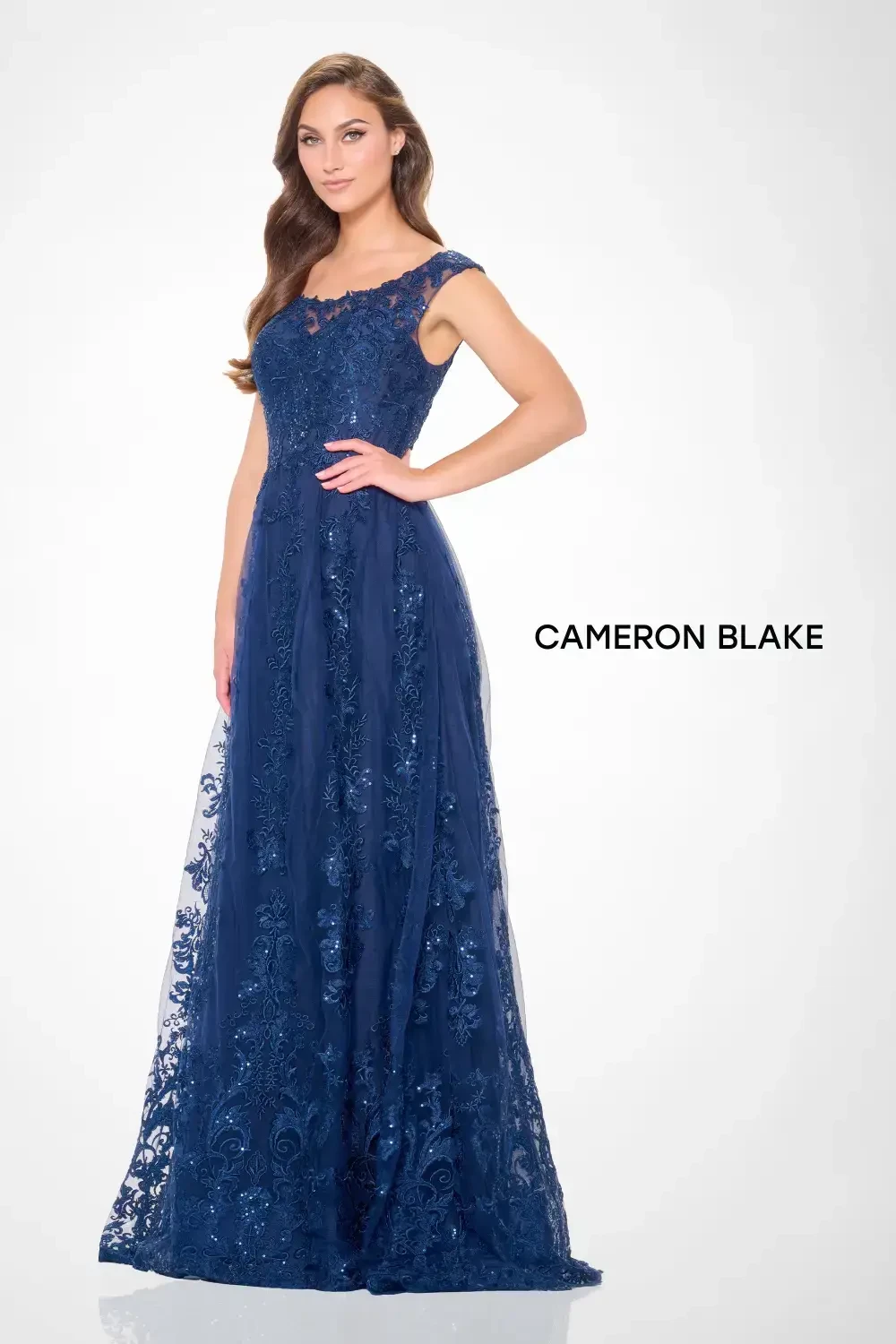 model is wearing a beaded mother of the bride gown
