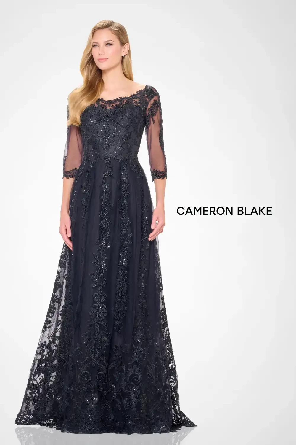 model is wearing a beaded mother of the bride gown