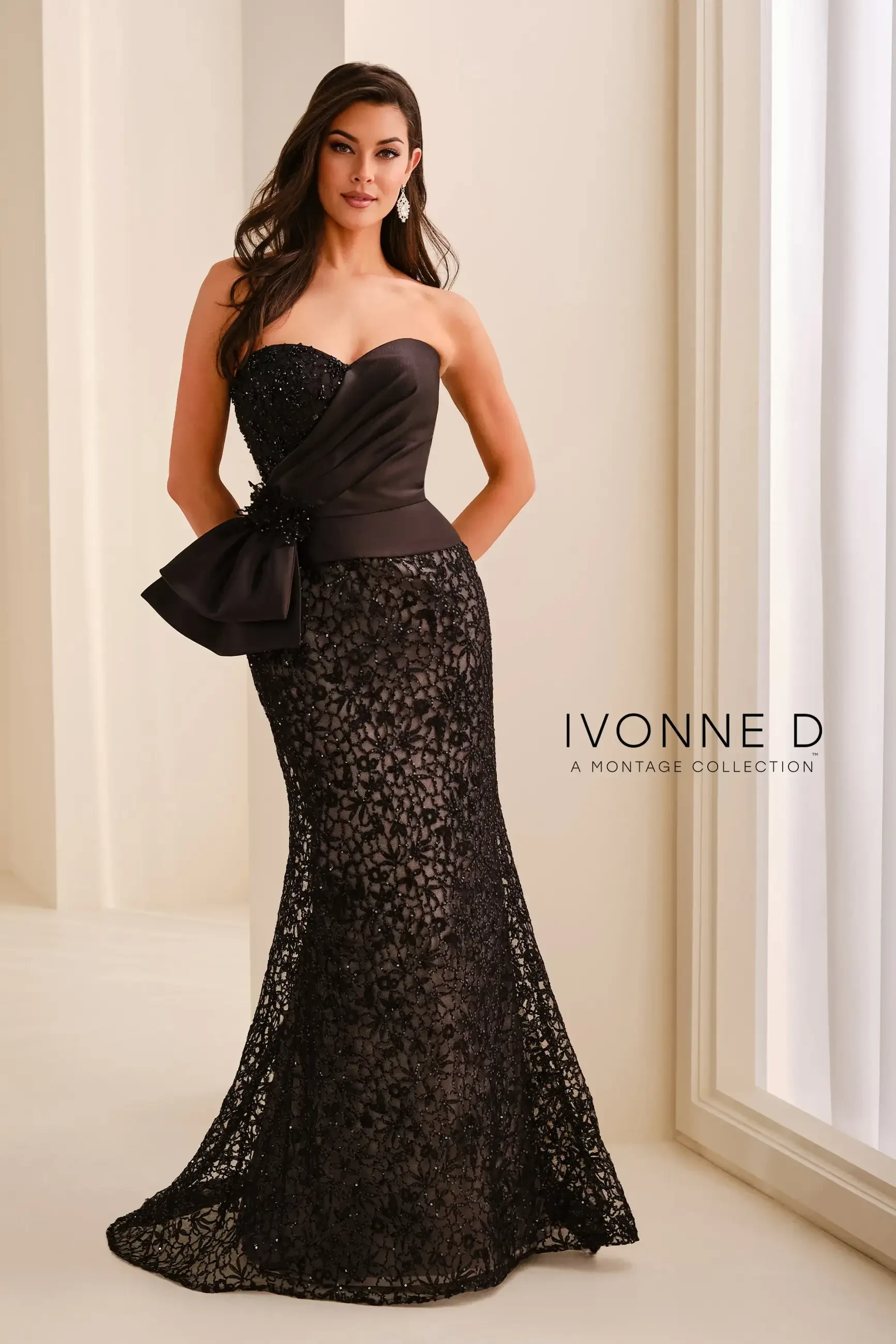 model is wearing a black strapless mothers dress