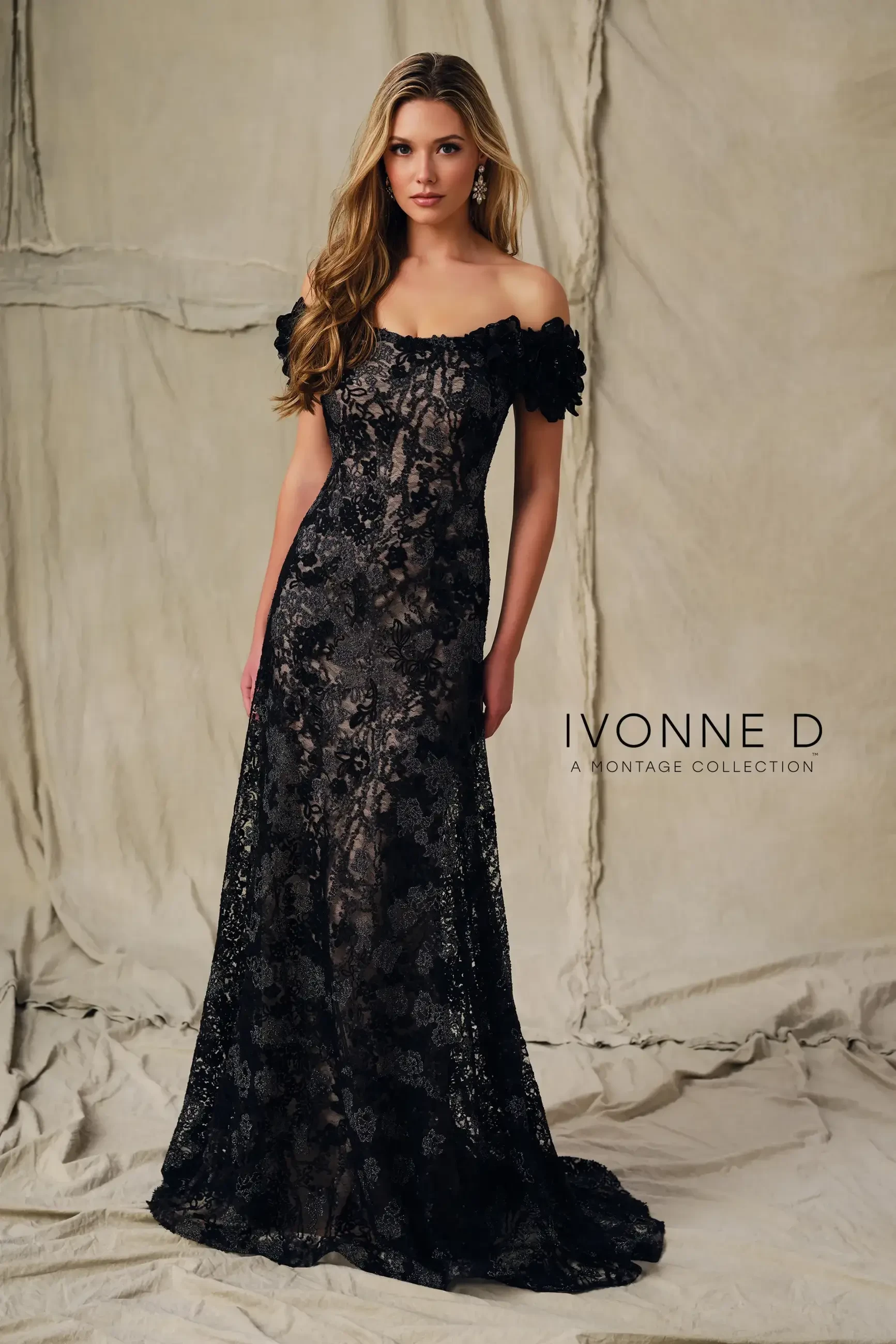 model is wearing a black and taupe mothers dress