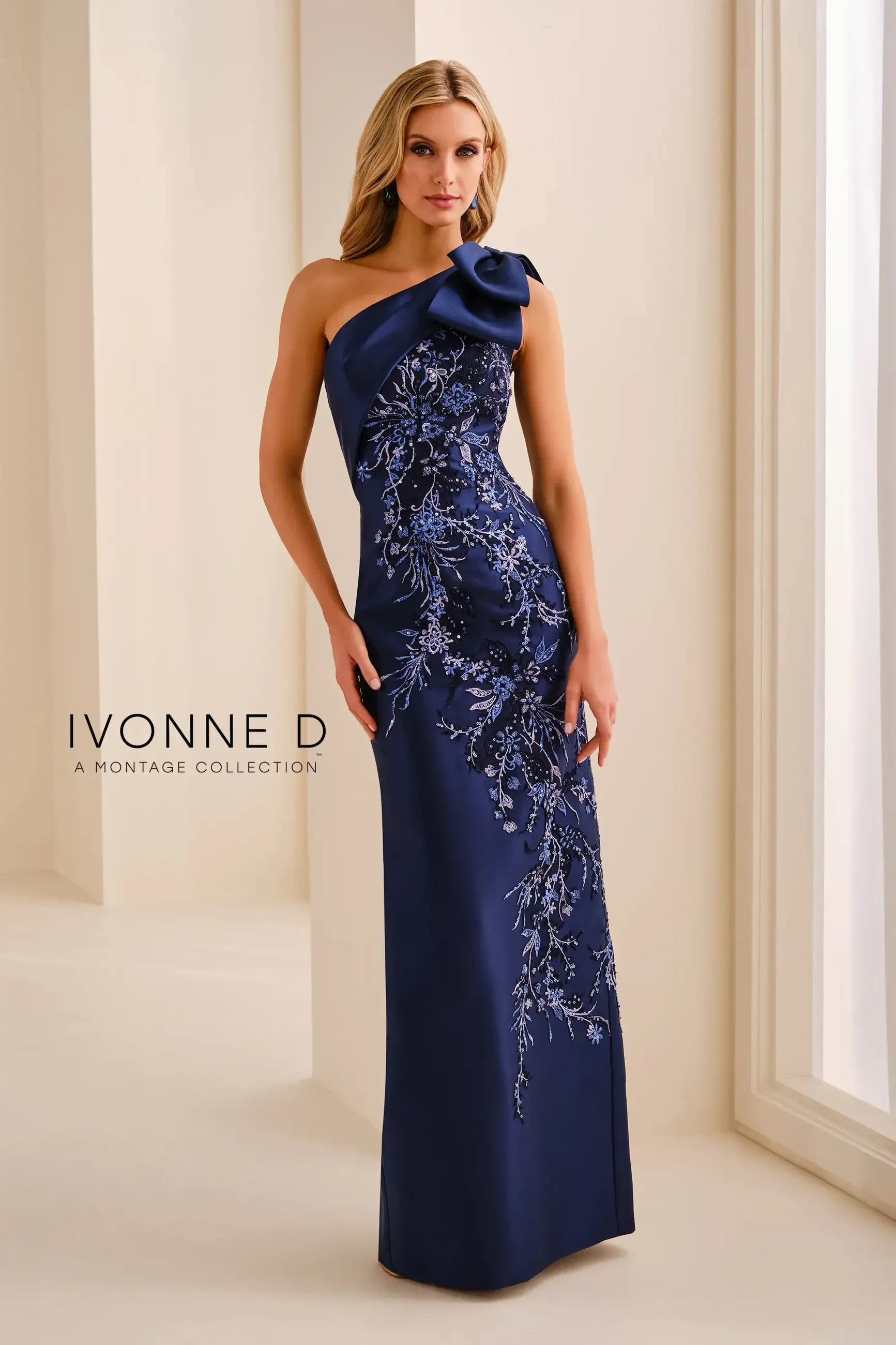model is wearing a navy blue one shoulder mothers dress