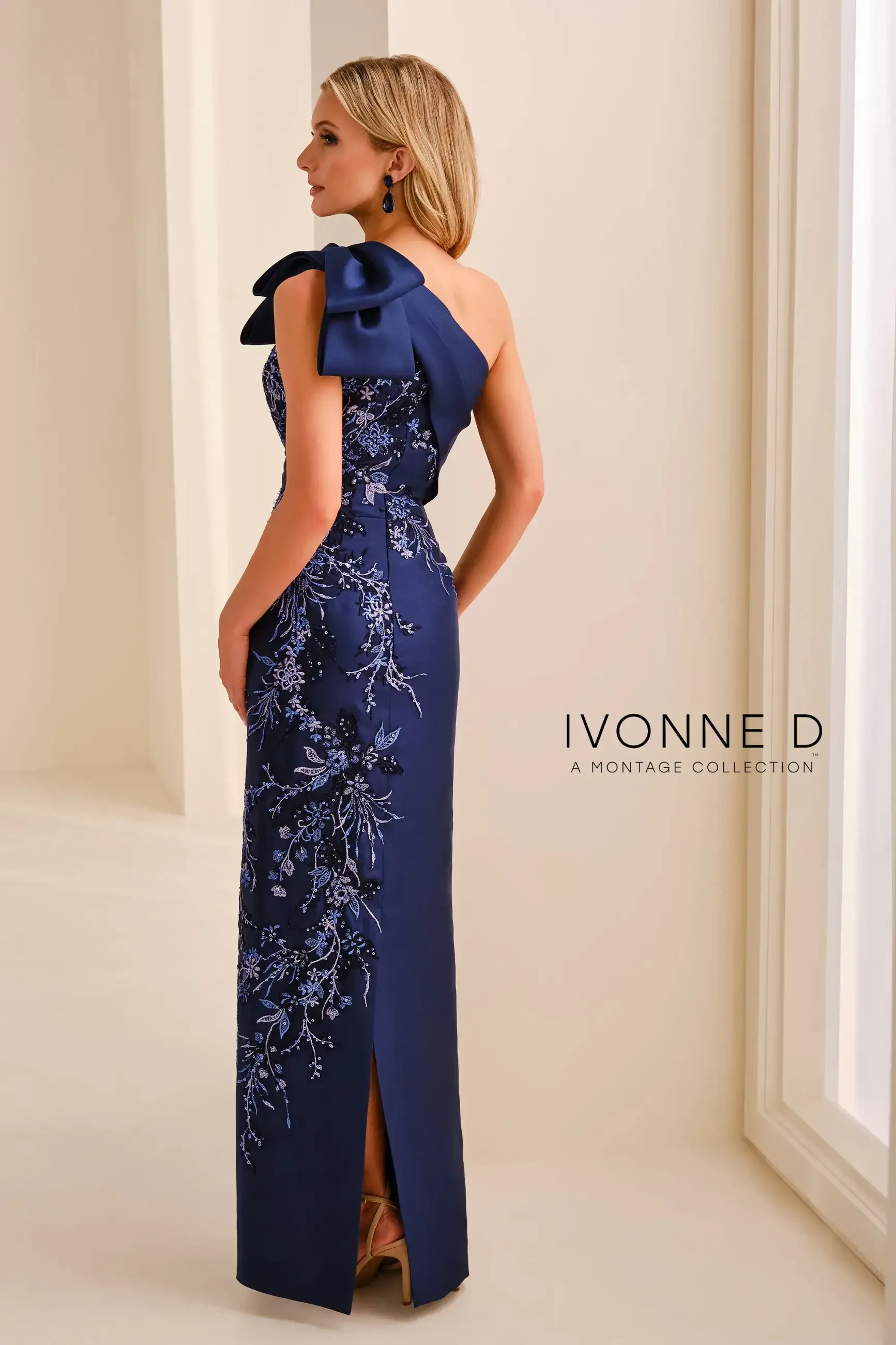 model is wearing a navy blue one shoulder mothers dress